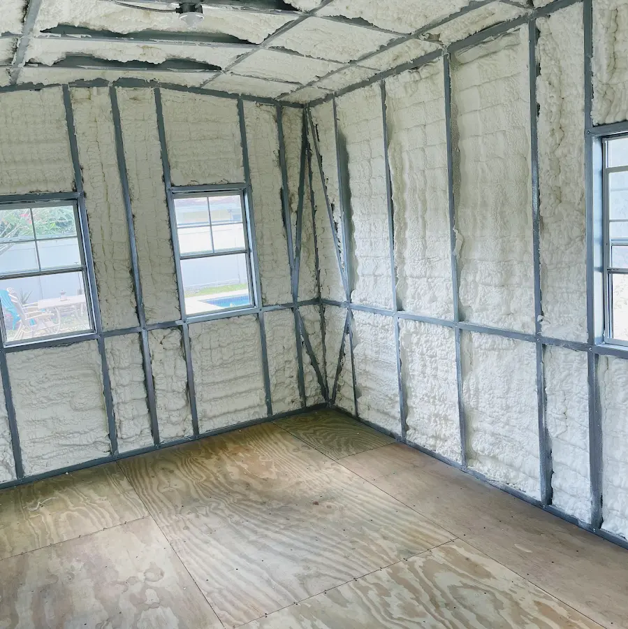 Closed-cell spray foam insulation applied to wall cavities in a residential project in Elm Grove